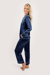 Our model wearing long-sleeve Rose Navy silk pyjama set on white background - side look