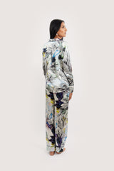 Our model wearing long-sleeve Rose Nilofar silk pyjama set on white background - back look