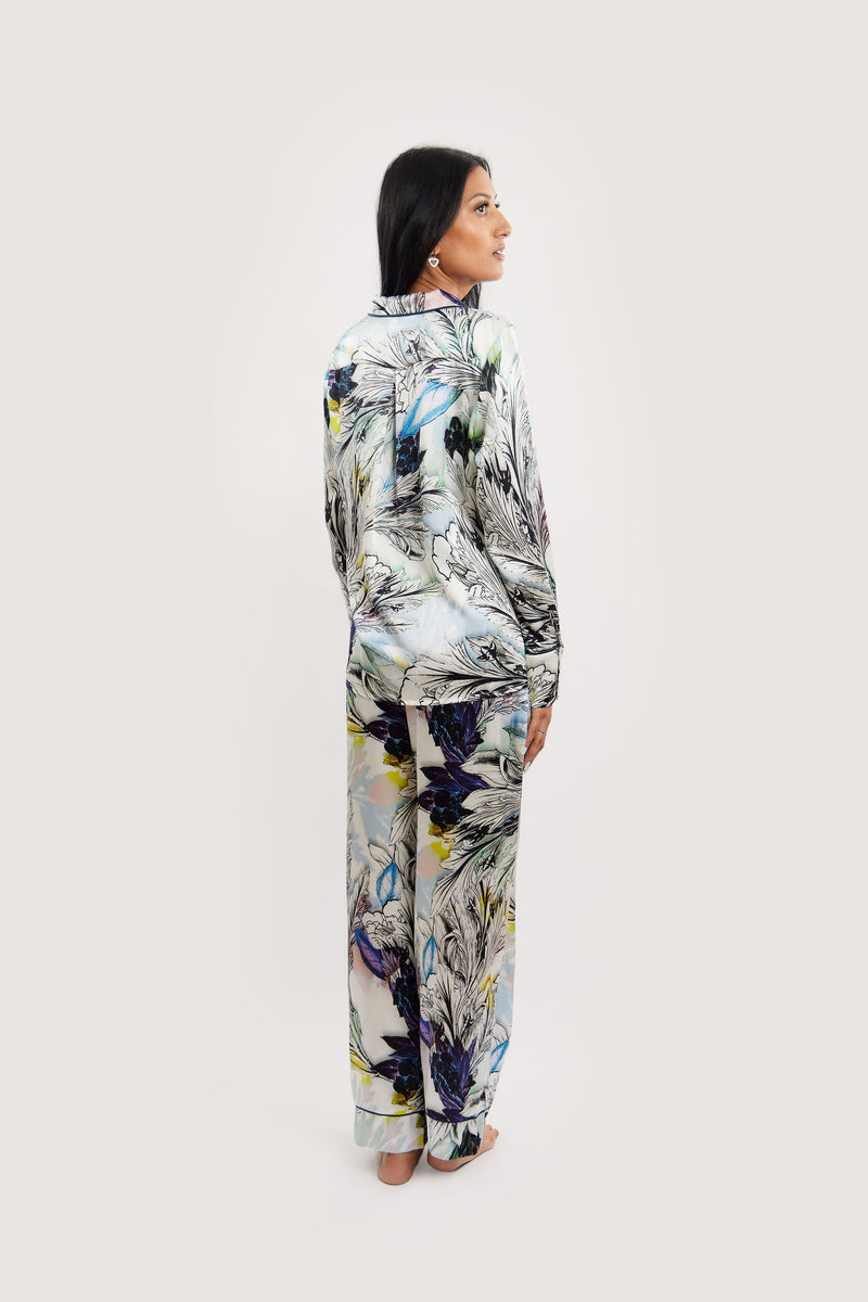 Our model wearing long-sleeve Rose Nilofar silk pyjama set on white background - back look