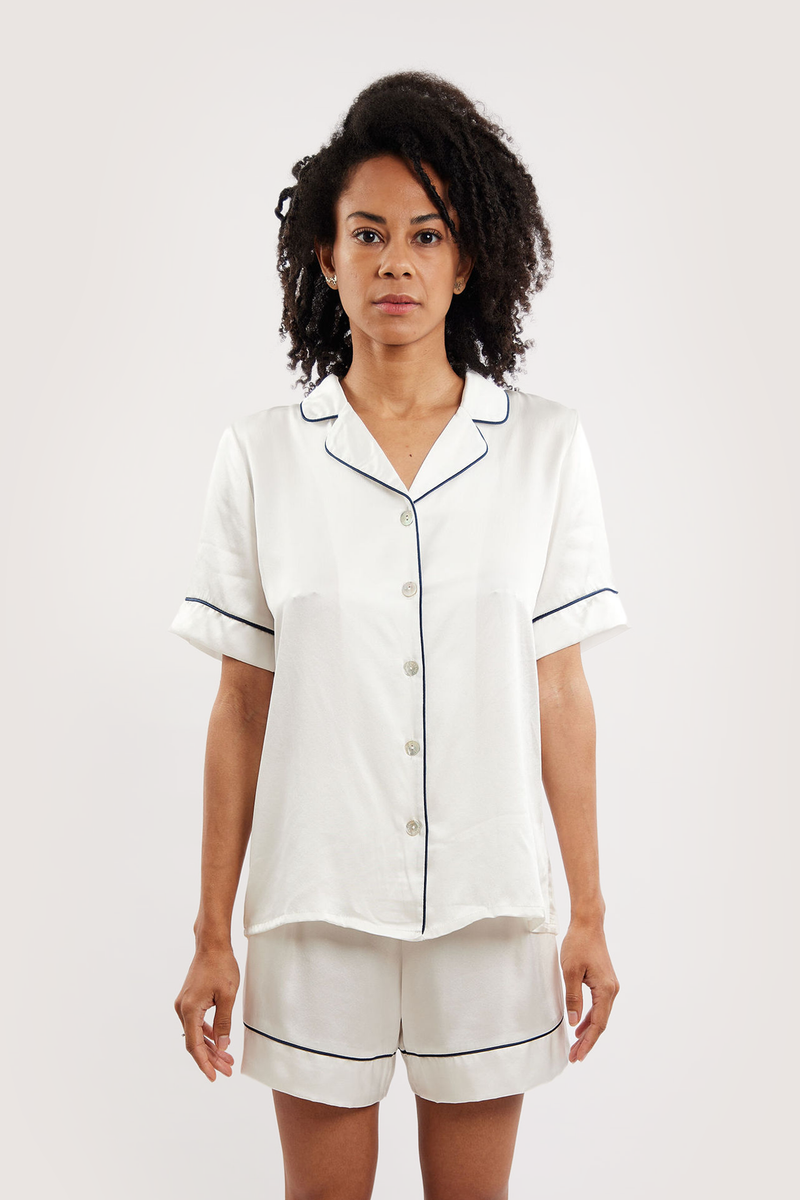 Our model wearing short-sleeve Eva Ivory silk pyjama set on white background - front look