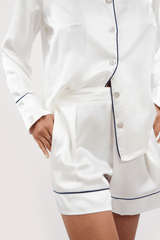 Our model wearing long-sleeve Iris Ivory silk pyjama set on white background - front close-up look