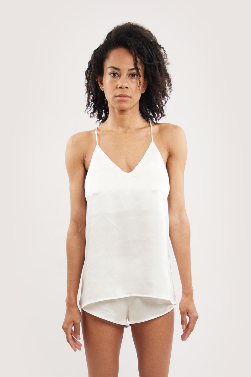 Our model wearing Dee Ivory silk camisole set on white background - front look
