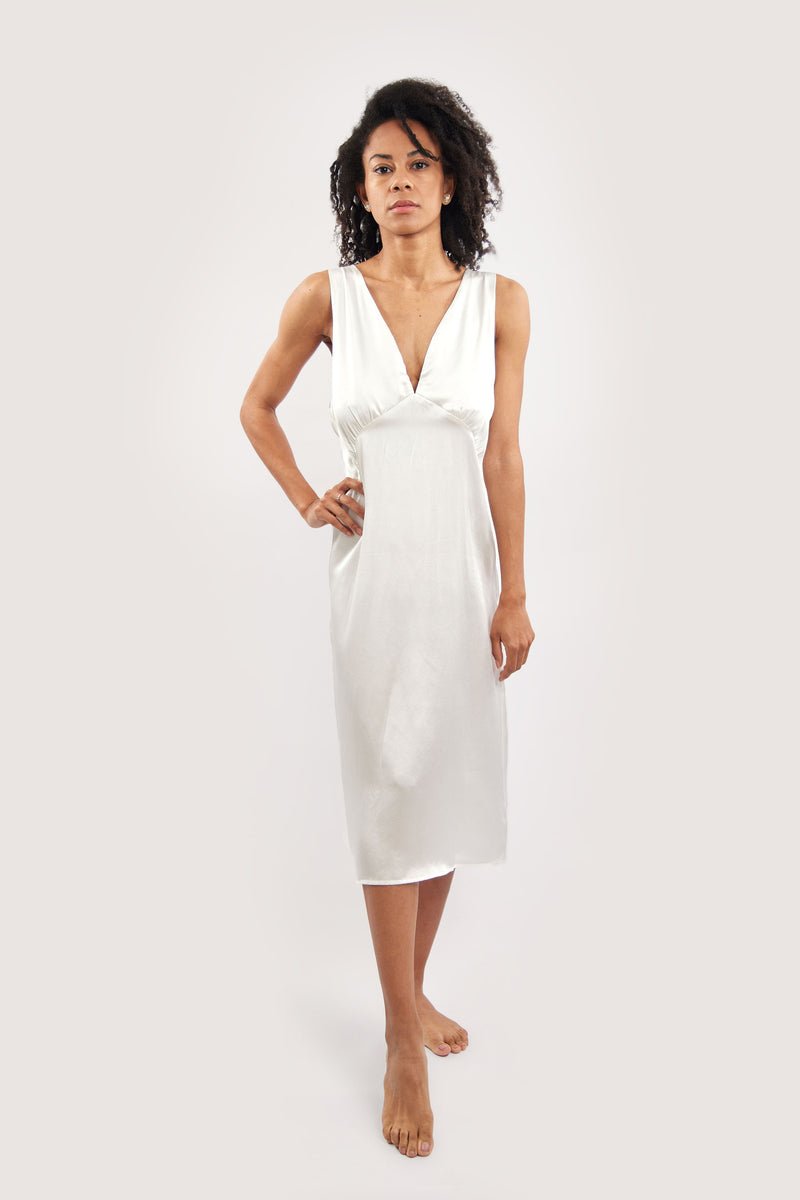 Our model wearing Sophia Ivory silk slip dress on white background - front look