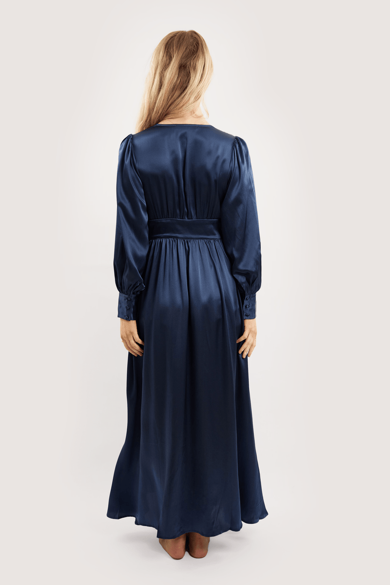Our model wearing Coco Navy silk robe on white background - back look